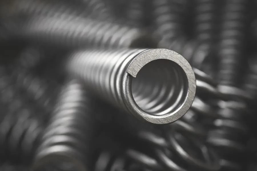 Macro view of coiled metal springs showing internal diameter and precision-engineered form.