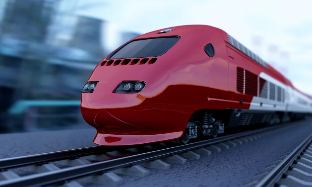 A 3D rendered illustration of a sleek, aerodynamic red and white high-speed passenger train travelling along a track at speed, with a blurred urban background suggesting motion.