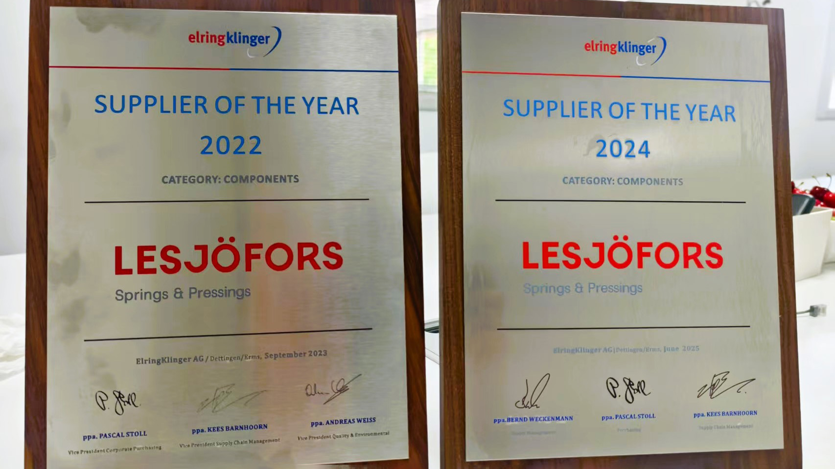 Two plaques reading "Supplier of the Year" for 2022 and 2024 awarded to Lesjöfors Springs & Pressings. The plaques are displayed side by side.