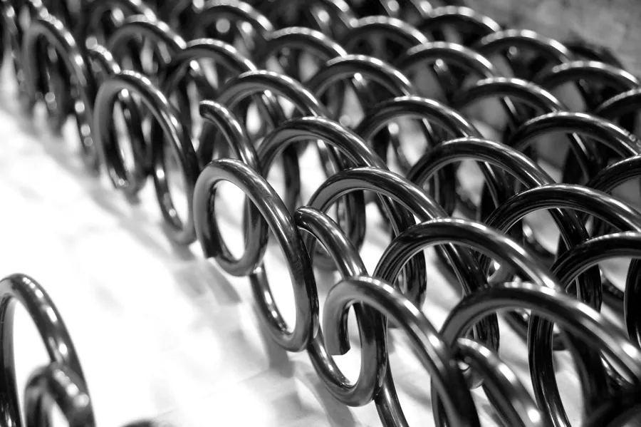Close-up of steel coil springs used within a sprung gym flooring system.
