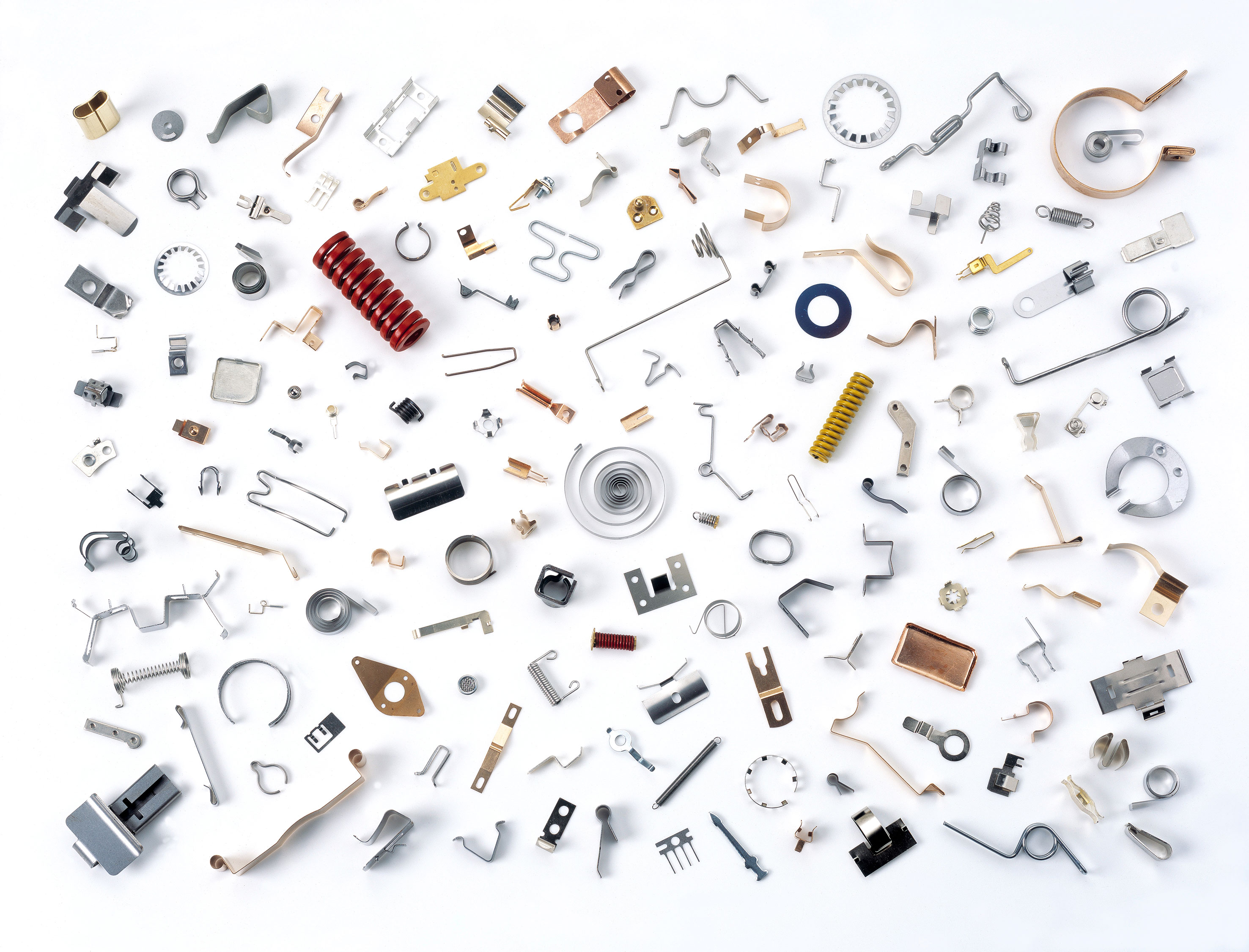 A collection of various metalsprings on a white background. Springs in different sizes and colours. 